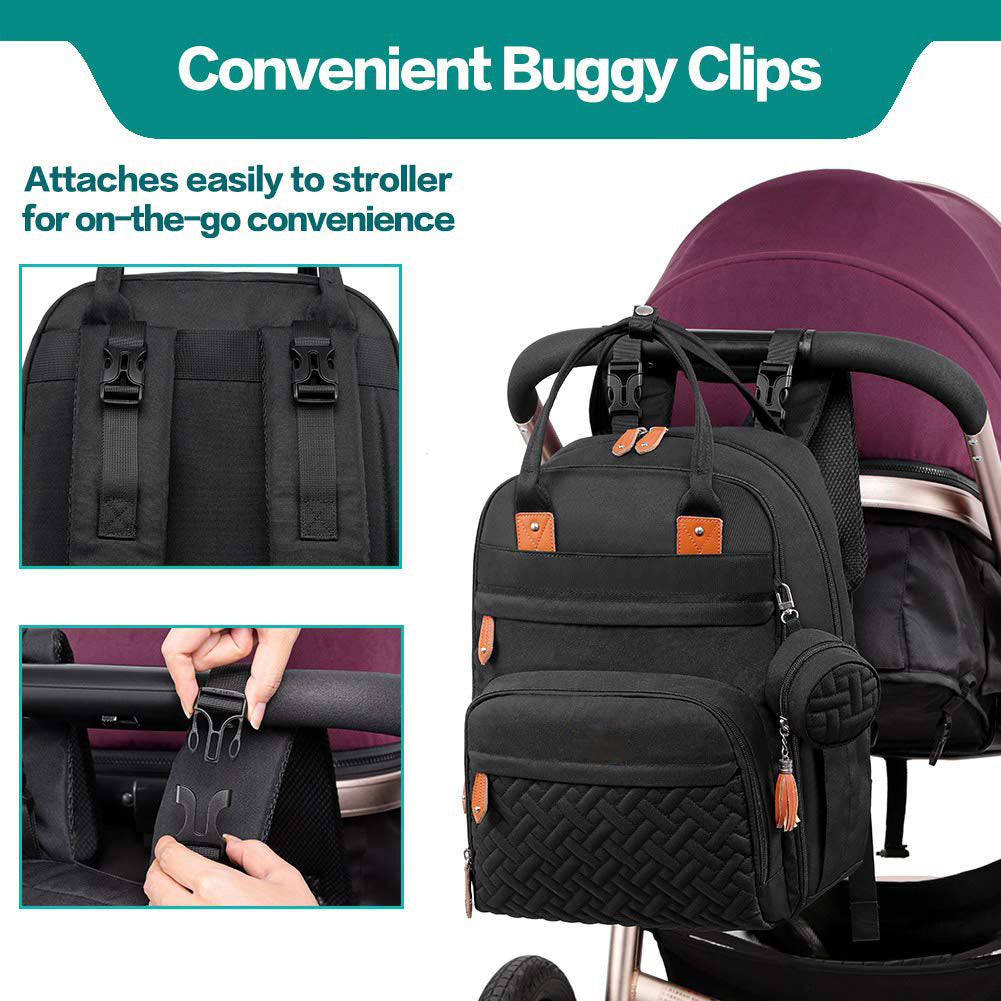 Black nappy bag backpack clipped to stroller handle with convenient buggy clips